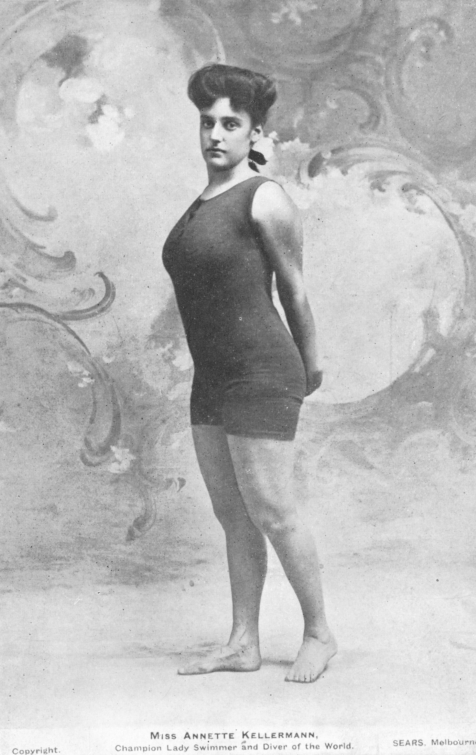 Annette Kellerman posing in a fitted swimming costume around 1910