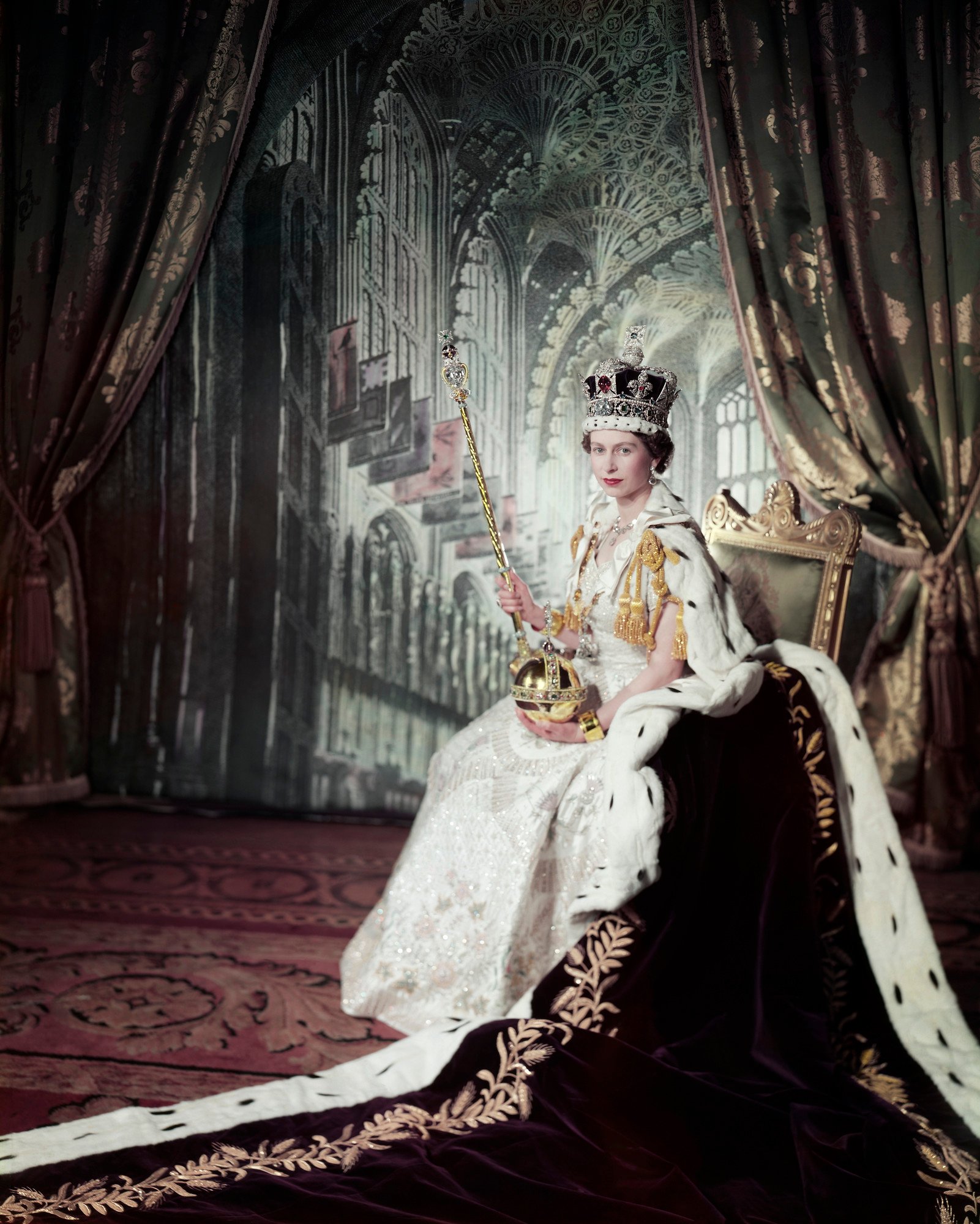 Queen Elizabeth II in her 1953 coronation portrait, wearing the Imperial State Crown and holding the orb and sceptre.