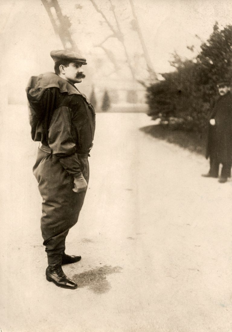 Franz Reichelt standing in the parachute suit he designed