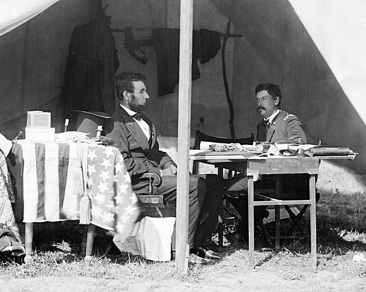 Abraham Lincoln meeting General George B. McClellan inside a tent at Antietam in 1862