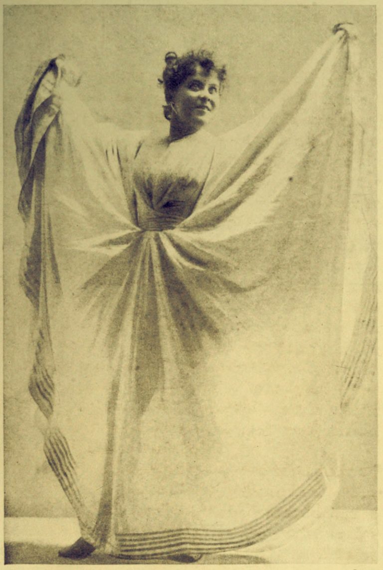 Loie Fuller holding out the sides of her original serpentine dance dress