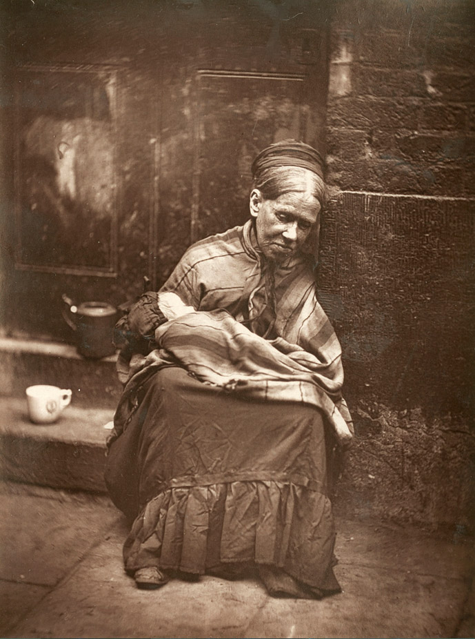 London’s poor: a homeless woman holding a baby on a doorstep, photographed by John Thomson in 1876–1877
