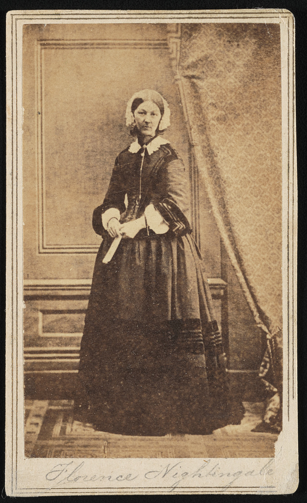 Nightingale standing in a full-length studio portrait